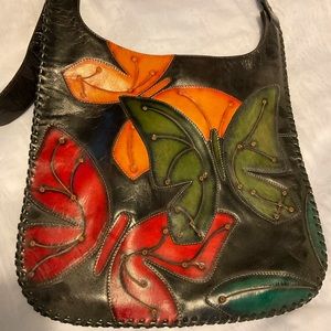 Hand tooled leather shoulder bag